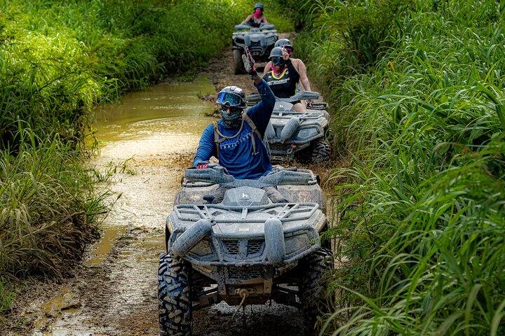 ATV riding through tropical terrain in Puerto Rico countryside